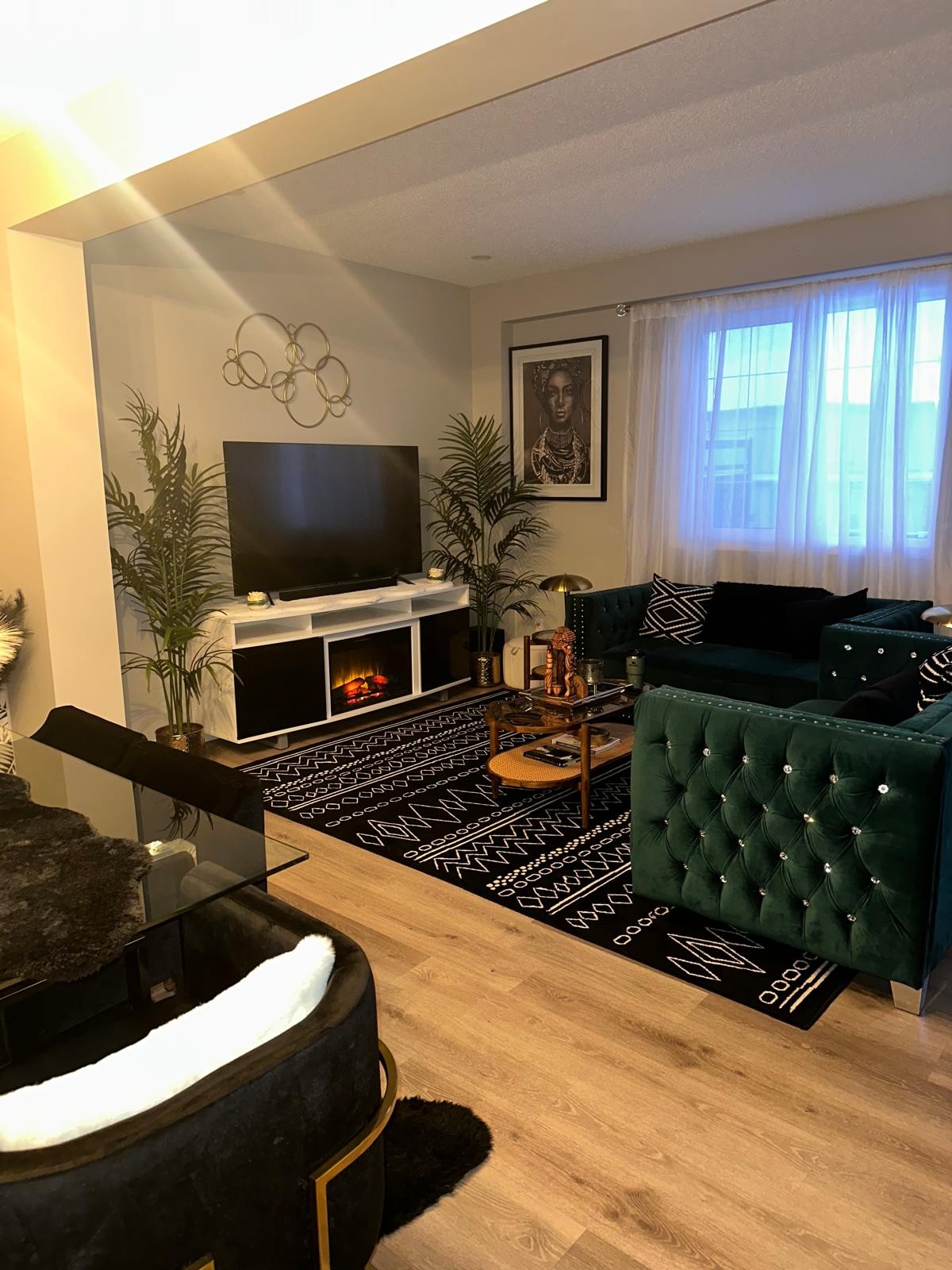 Angled view of the emerald velvet seating arrangement